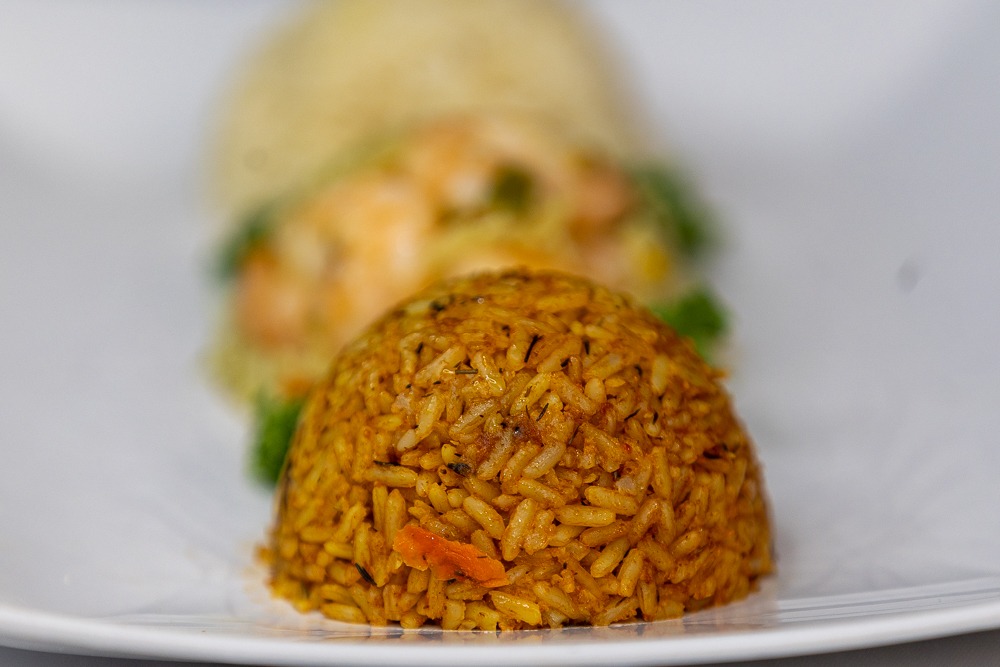 Three rice varieties — jollof, shrimp fried and plain rice