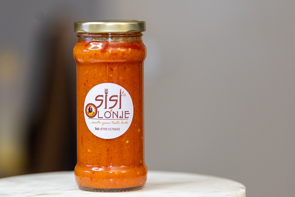 Sisi Olonje Hot Sauce in branded jar — scotch bonnet based